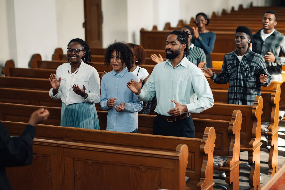 Diverse church members sing, pray, and worship together, celebrating hope, belief, and unity in the christian faith
